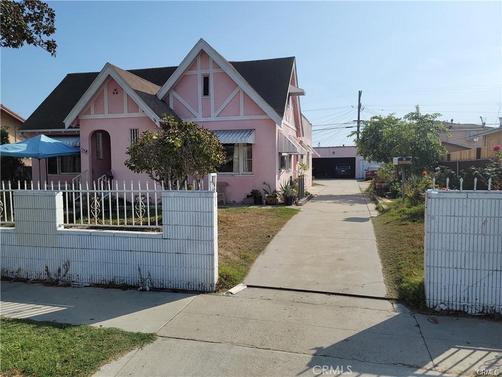 2738 Southern, Unit B South Gate, CA 90280 - Photo 1 of 19 a front view of a house with a garden