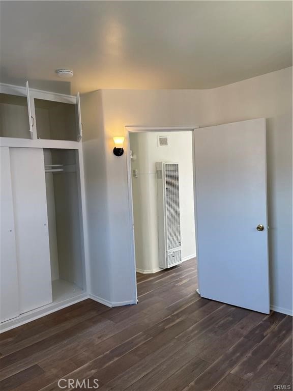 2738 Southern, Unit B South Gate, CA 90280 - Photo 16 of 19 an empty room with wooden floor and windows