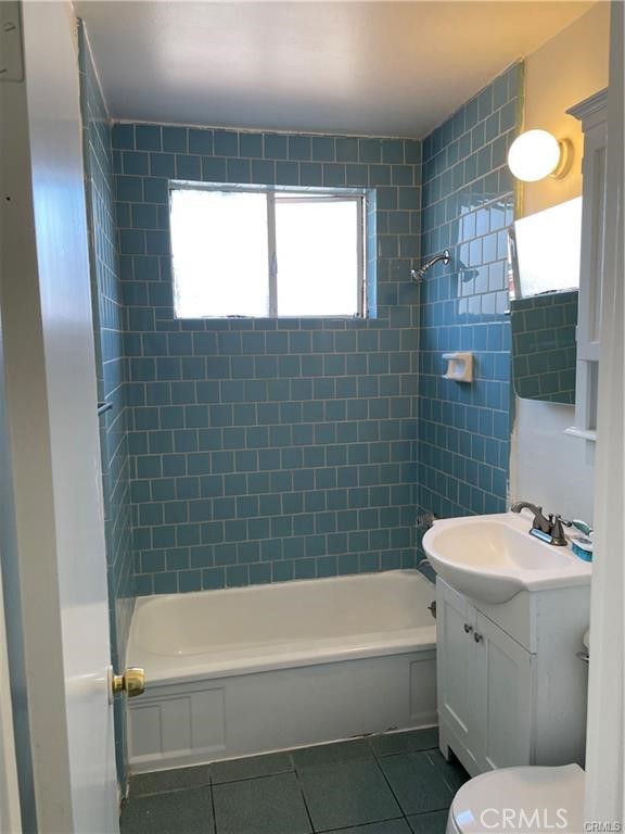 2738 Southern, Unit B South Gate, CA 90280 - Photo 19 of 19 a bathroom with a bathtub a sink and a toilet