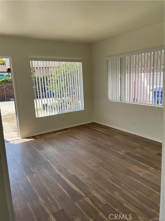 2738 Southern, Unit B South Gate, CA 90280 - Photo 9 of 19 an empty room with wooden floor and windows