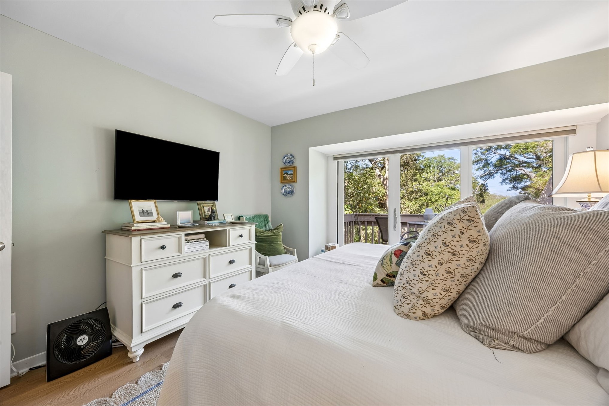 2005 Beachwood Road, Unit 2005 Amelia Island, FL 32034 - Photo 16 of 43 a spacious bedroom with a bed and a flat screen tv