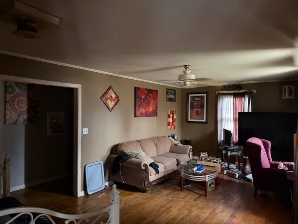 a kitchen with a sink appliances cabinets and a window