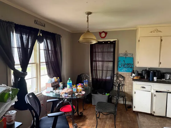 a bedroom with furniture and a chandelier