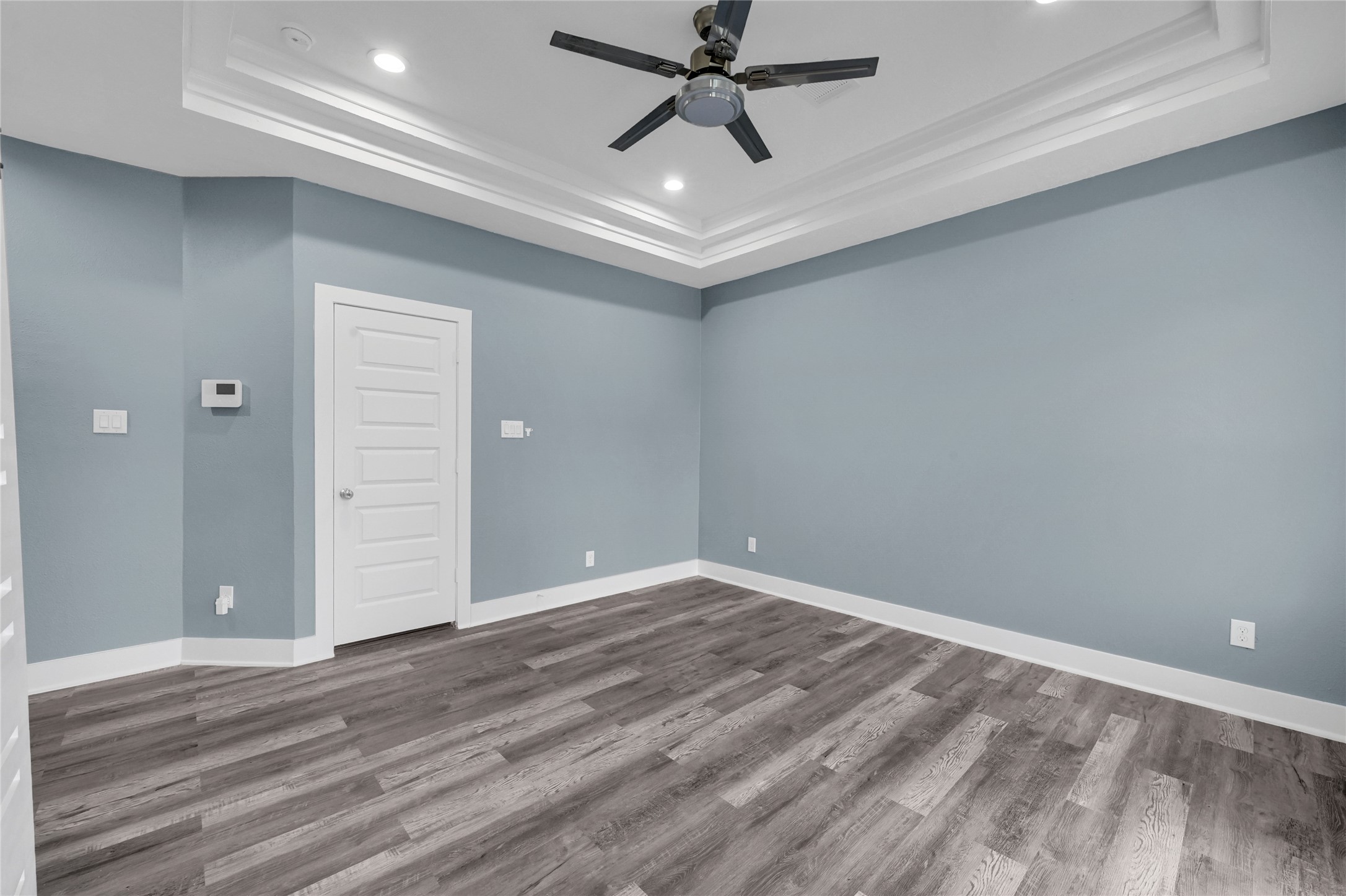 4304 New Orleans Street Houston, TX 77020 - Photo 12 of 23 en empty room with wooden floor and ceiling fan
