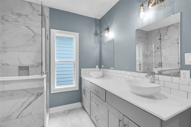 a bathroom with a bathtub and shower