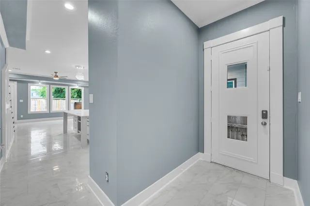 a view of a hallway with white walls