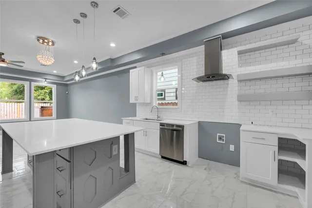 a kitchen with cabinets and sink