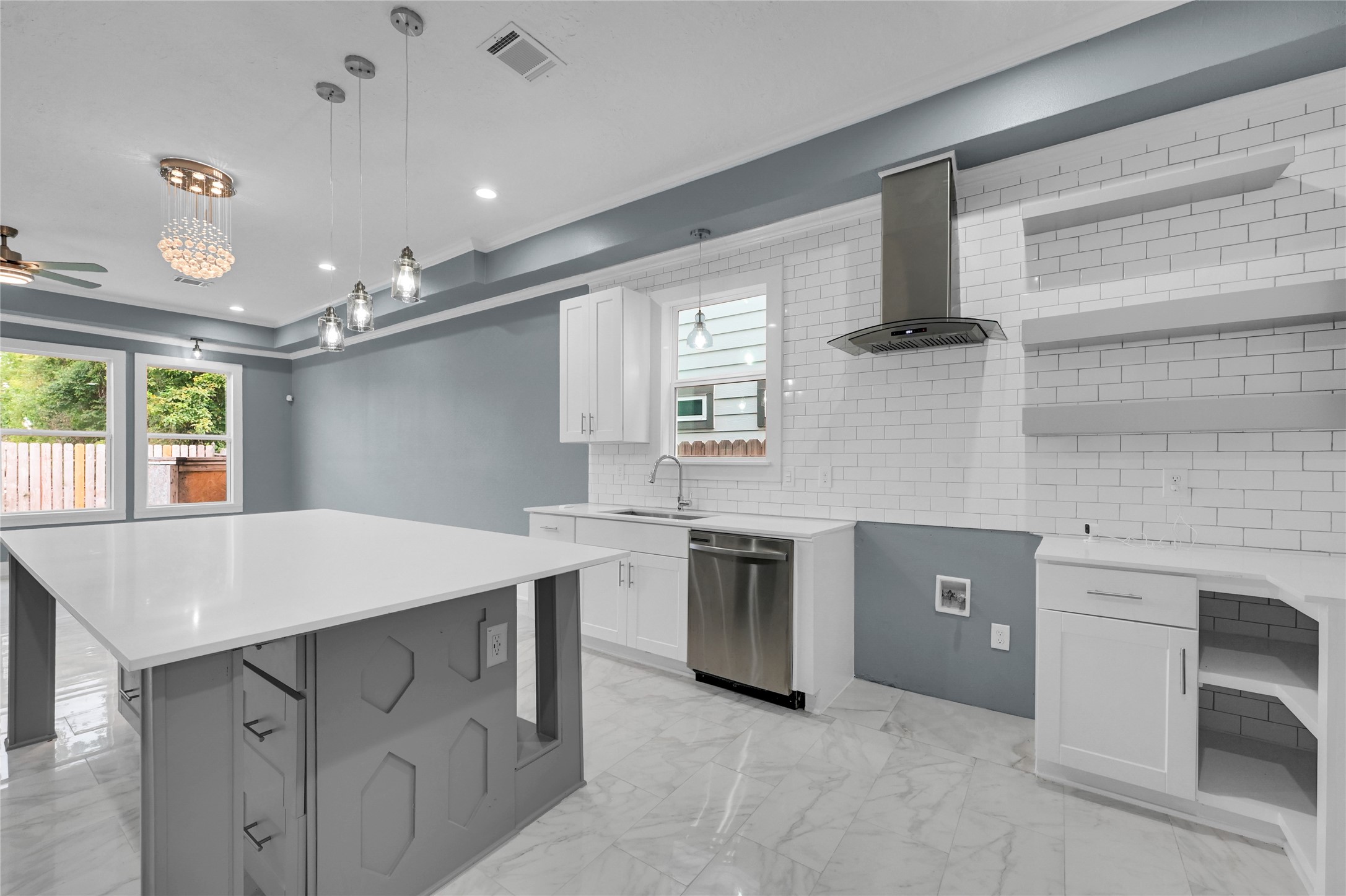 4304 New Orleans Street Houston, TX 77020 - Photo 5 of 23 a kitchen that has a sink a stove and chairs