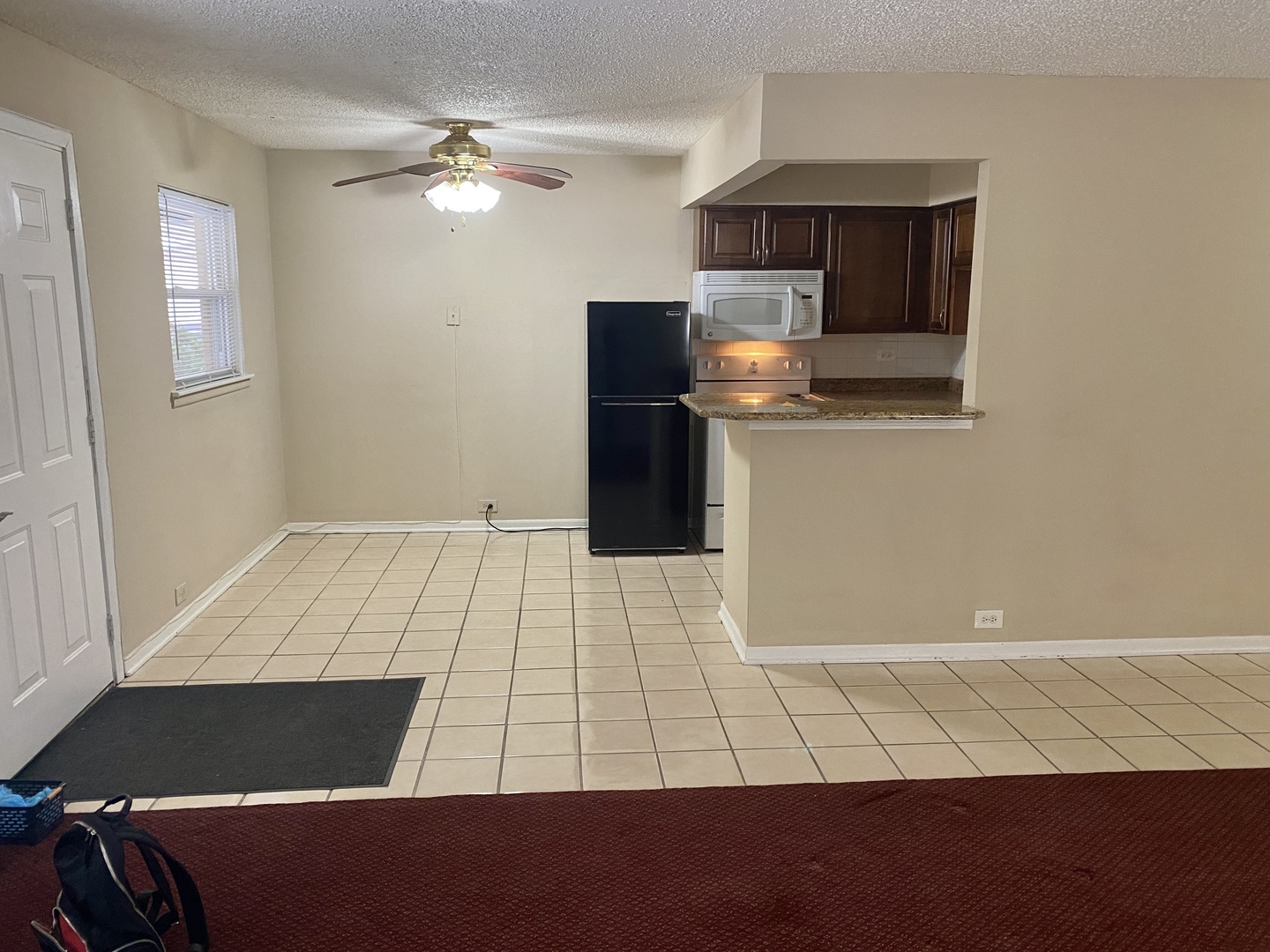 4041 South Harlem Avenue, Unit 3 Stickney, IL 60402 - Photo 7 of 12 a room with a bed and a television