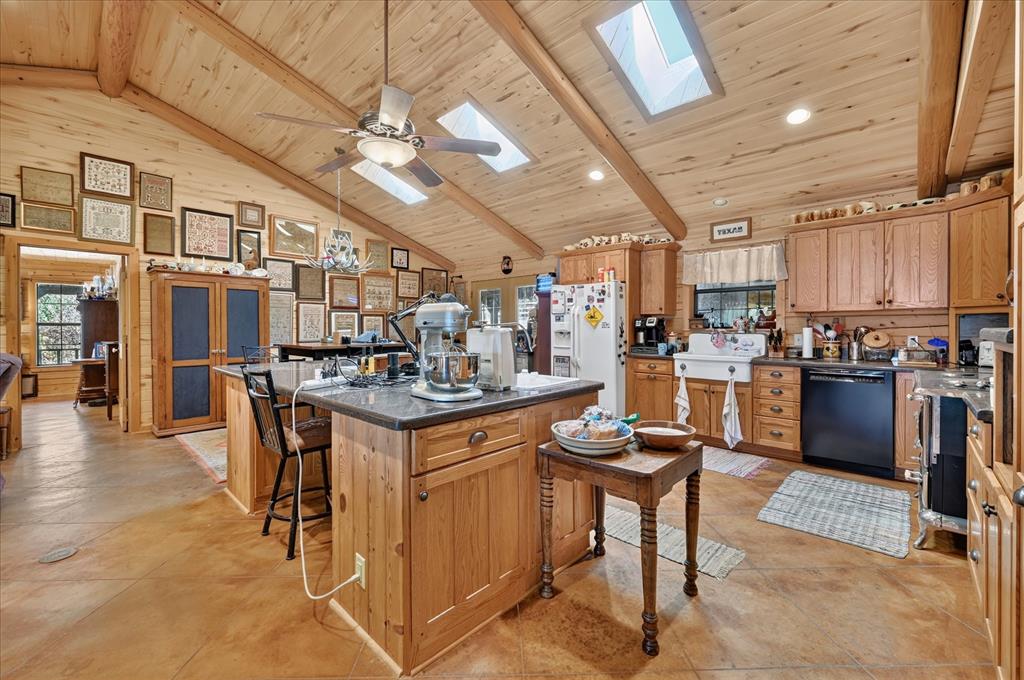 1623 3 Skillet Road Springtown, TX 76082 - Photo 16 of 40 Vaulted wood-paneled ceiling with exposed beams and skylights