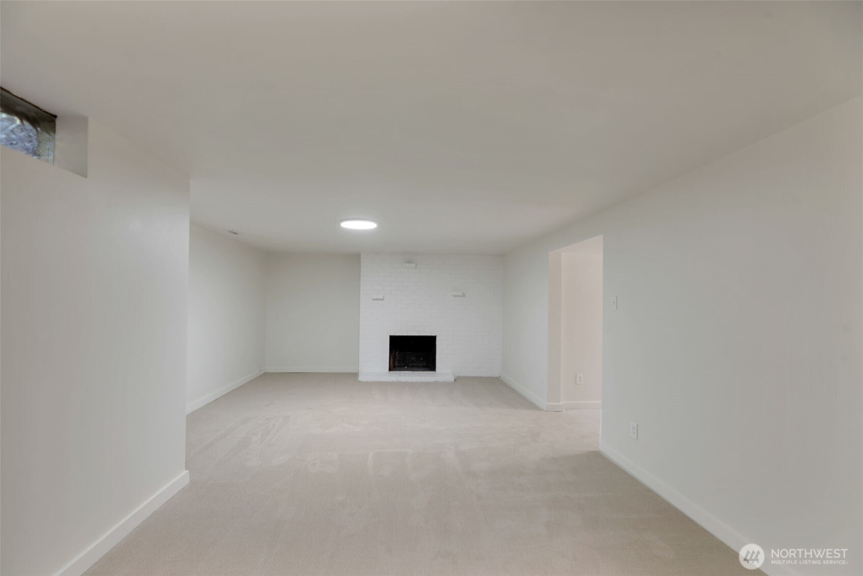 11229 29th Avenue Southwest Seattle, WA 98146 - Photo 18 of 28 a view of empty room with a fireplace