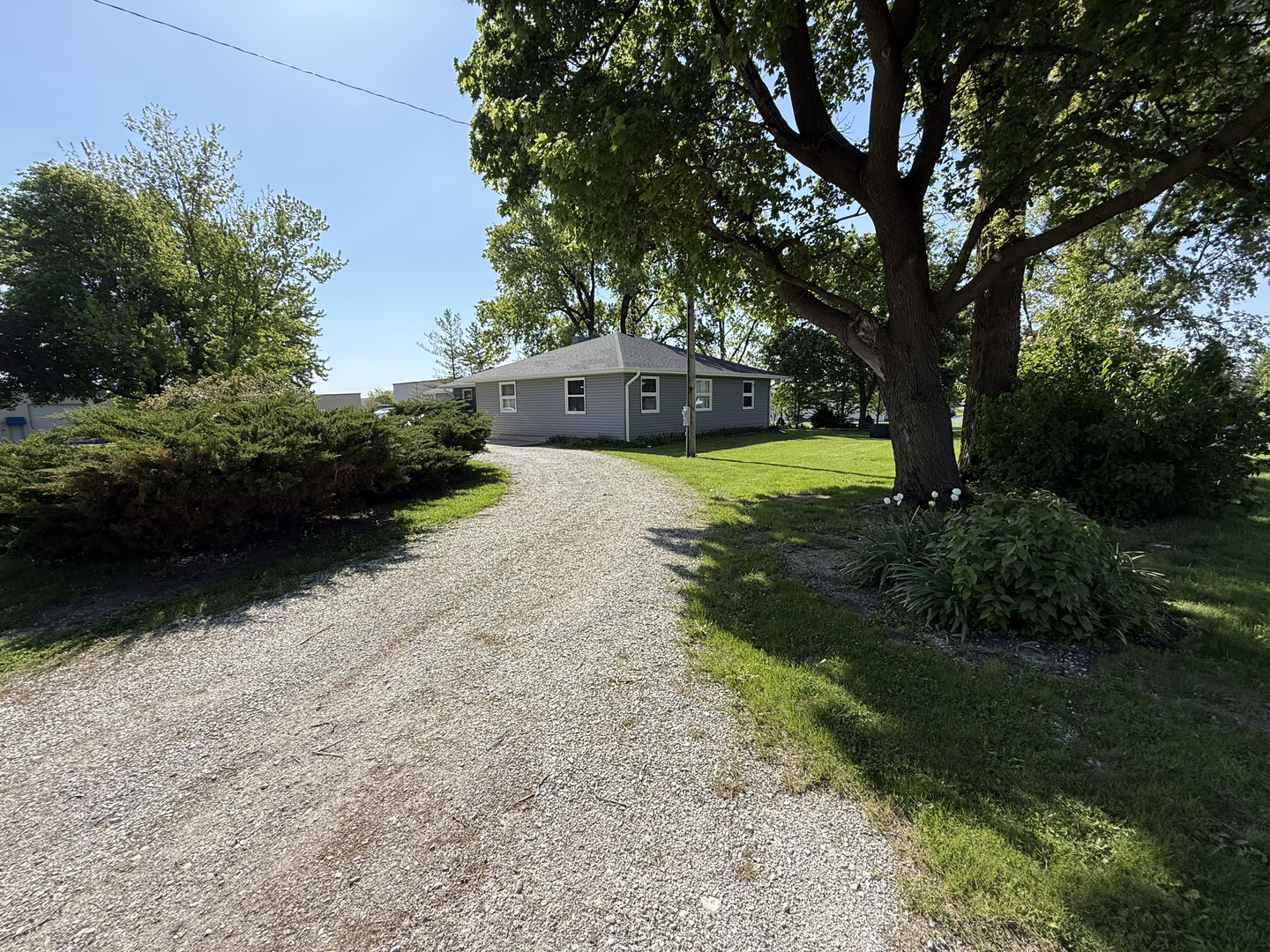 25501 West Wolfs Road Plainfield, IL 60585 - Photo 16 of 22 a front view of a house with garden