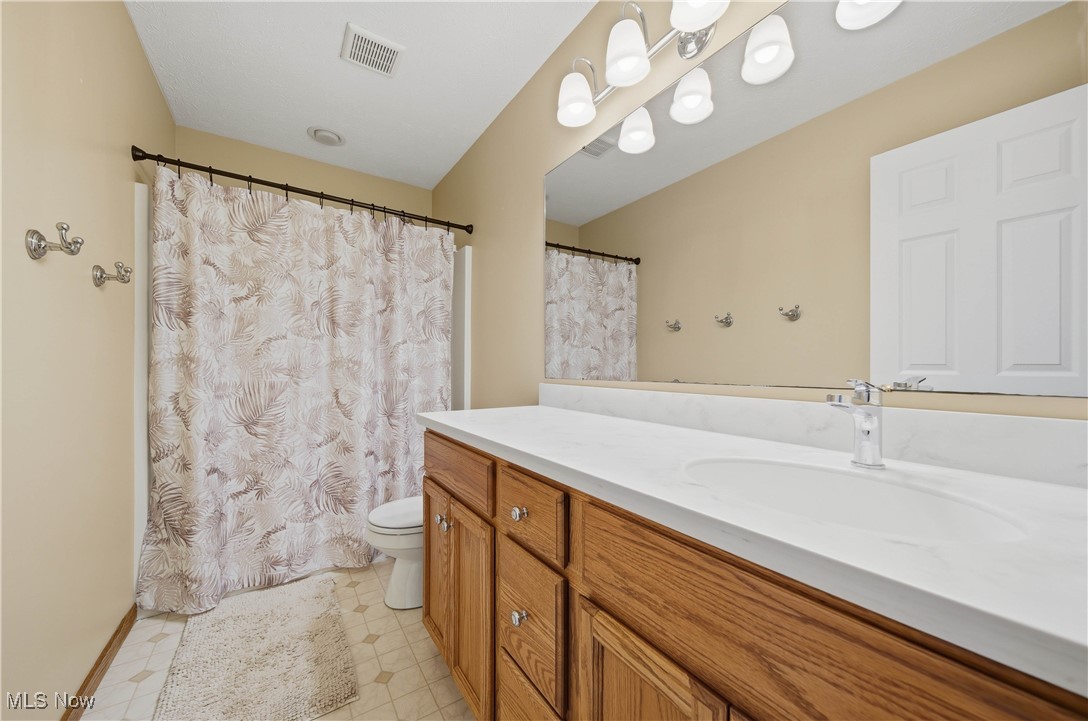 2132 Summerchase Road Northeast Canton, OH 44721 - Photo 32 of 49 Full bathroom featuring vanity and a shower with shower curtain