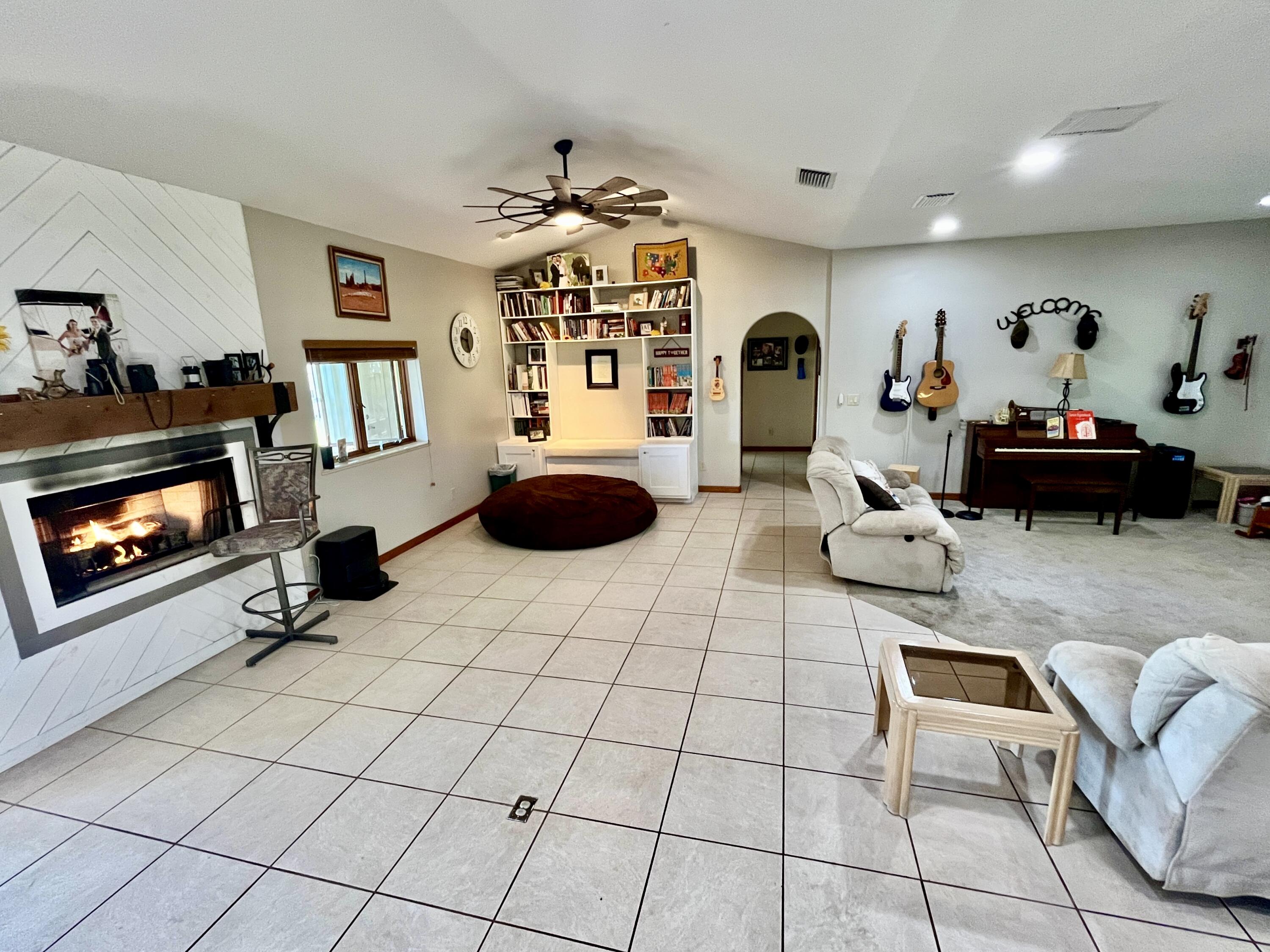 3046 North Bowden Road Avon Park, FL 33825 - Photo 10 of 41 a living room with furniture and a fireplace