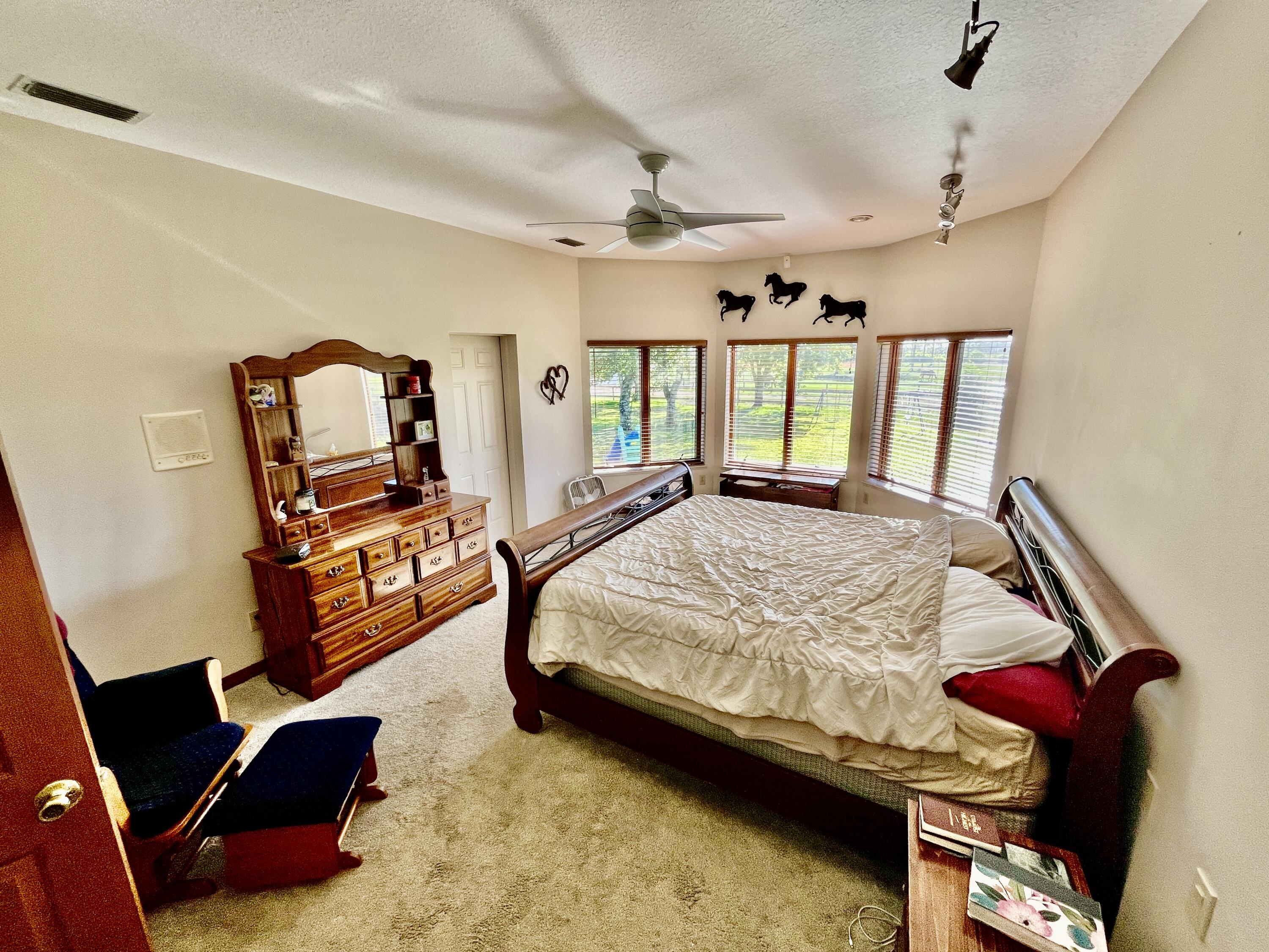3046 North Bowden Road Avon Park, FL 33825 - Photo 11 of 41 a bed room with a bed and a window