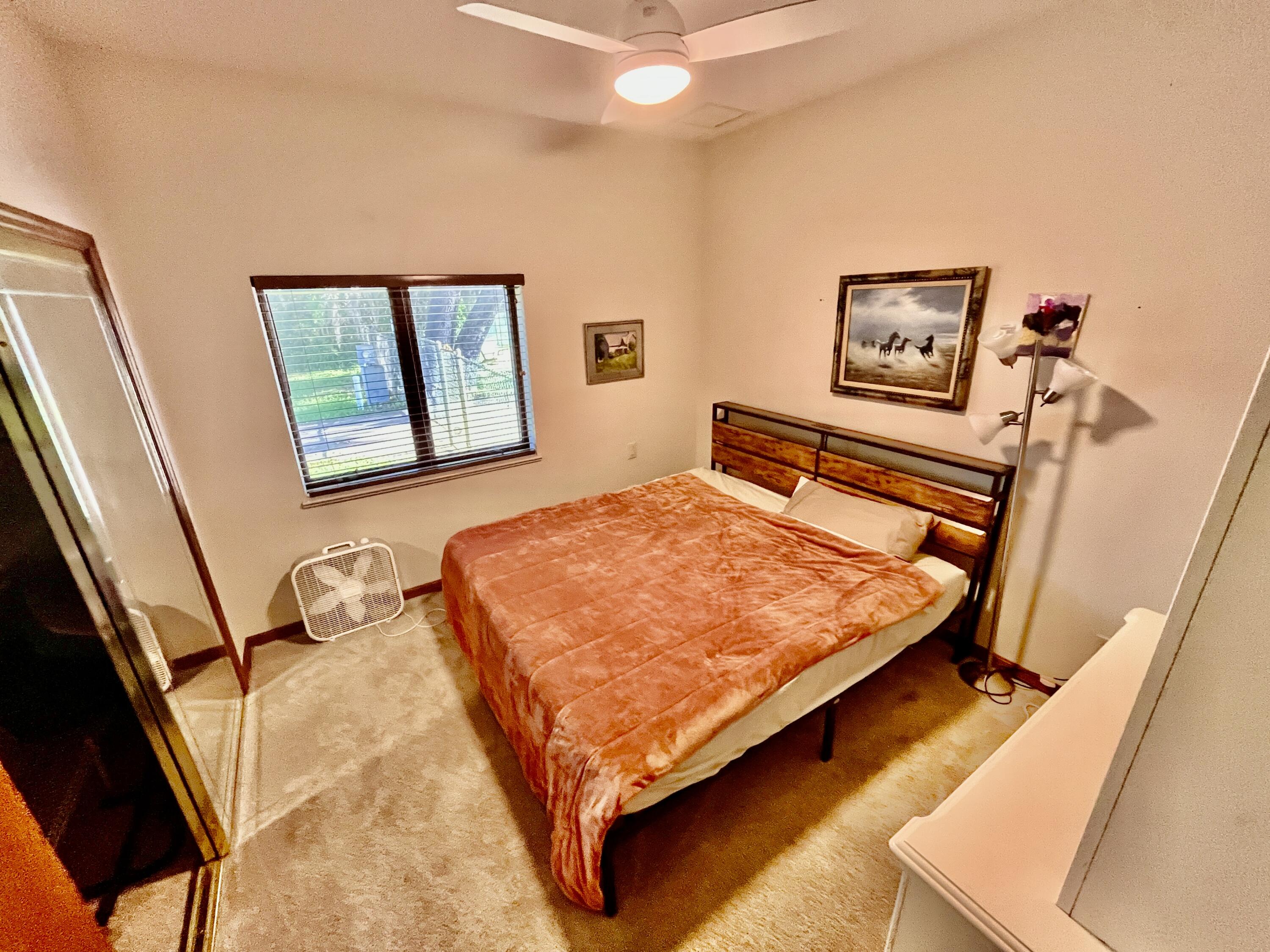 3046 North Bowden Road Avon Park, FL 33825 - Photo 15 of 41 a bedroom with a bed and painting on the wall