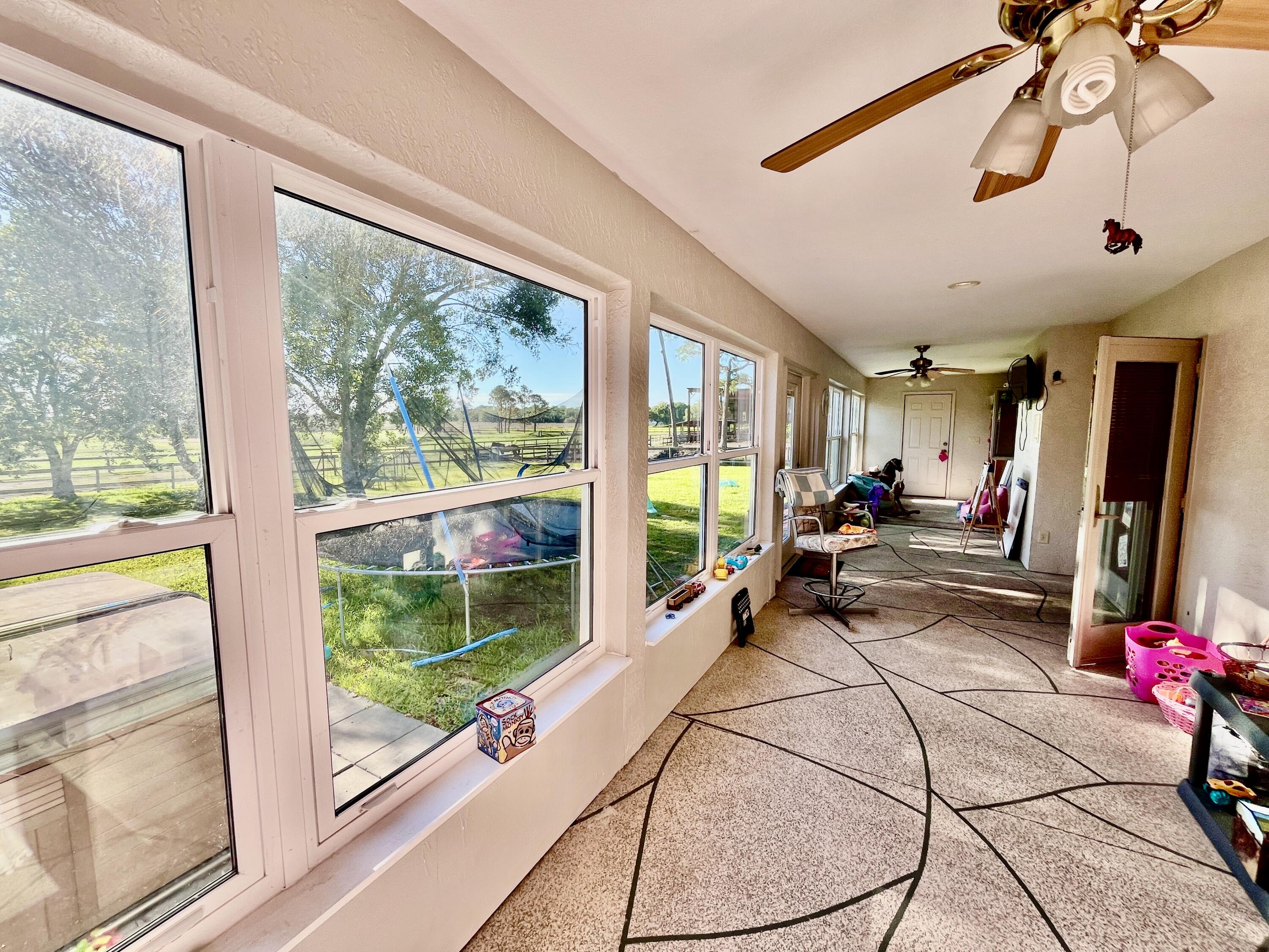 3046 North Bowden Road Avon Park, FL 33825 - Photo 19 of 41 a view of a room with gym equipment and a large window