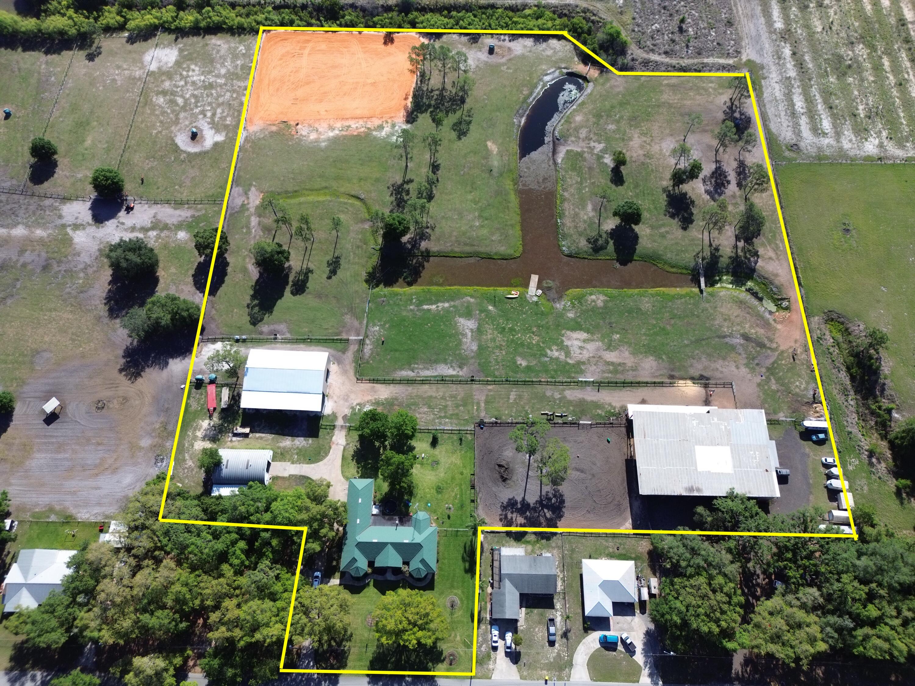 3046 North Bowden Road Avon Park, FL 33825 - Photo 2 of 41 an aerial view of a house with a garden