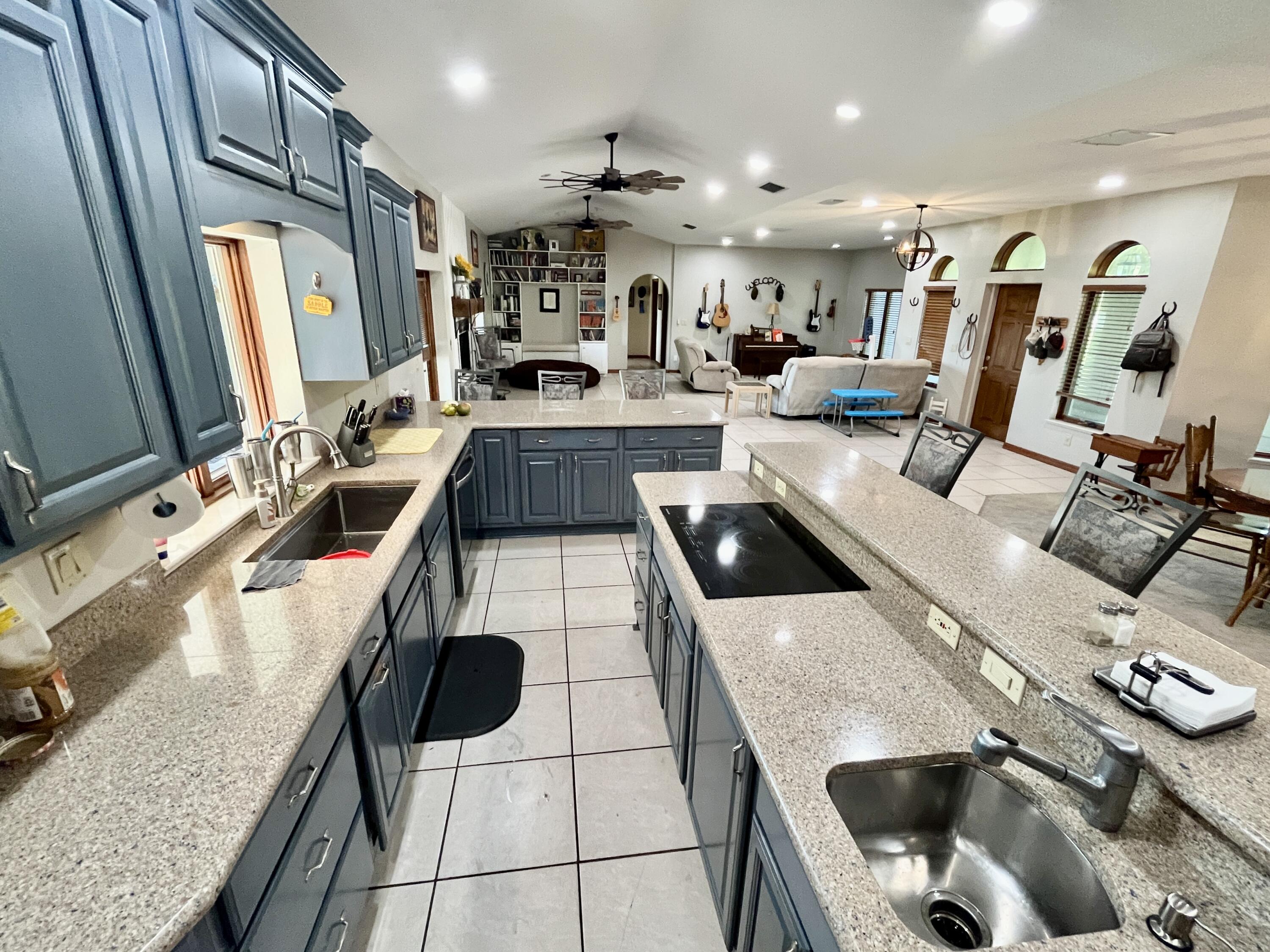 3046 North Bowden Road Avon Park, FL 33825 - Photo 4 of 41 a kitchen with stainless steel appliances kitchen island granite countertop a sink and a stove