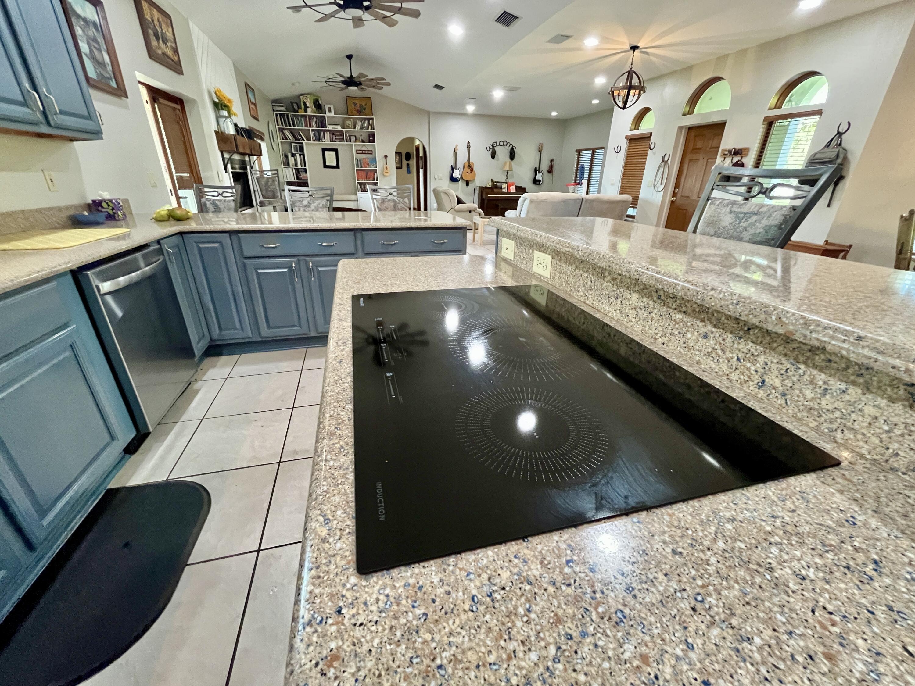 3046 North Bowden Road Avon Park, FL 33825 - Photo 5 of 41 a kitchen with stainless steel appliances kitchen island granite countertop a sink a counter top space