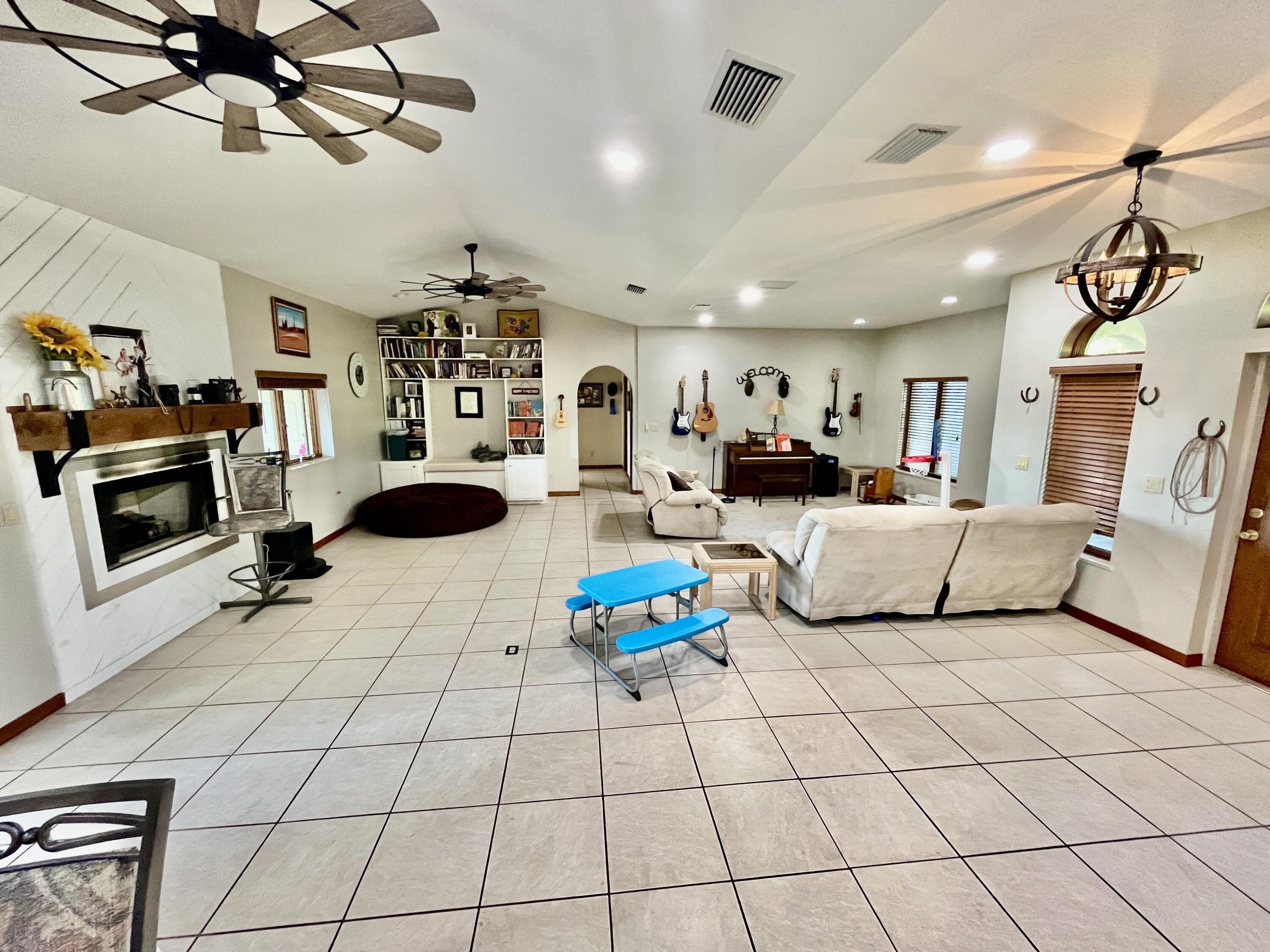 3046 North Bowden Road Avon Park, FL 33825 - Photo 9 of 41 a living room with furniture a flat screen tv and a window