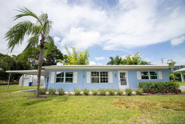 front view of a house with a yard