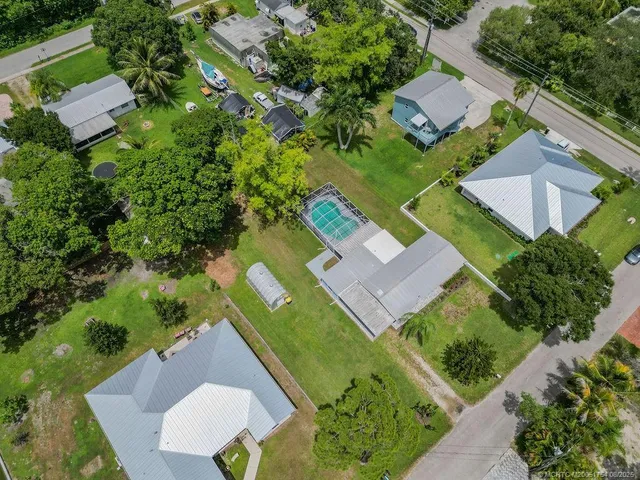 an aerial view of a house with a garden
