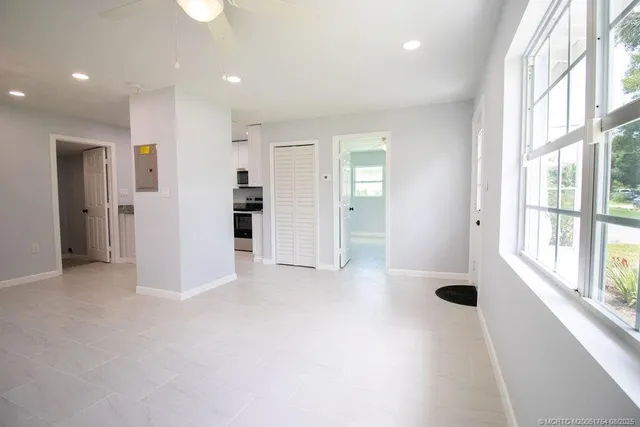 a view of an empty room with a window