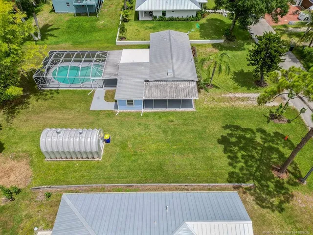 an aerial view of a house having swimming pool