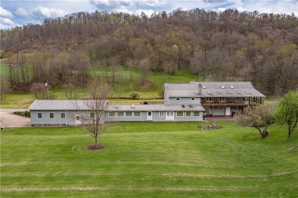 527 Claylick Road Holbrook, PA 15341 - Photo 4 of 24 a view of a lake with a mountain in the background