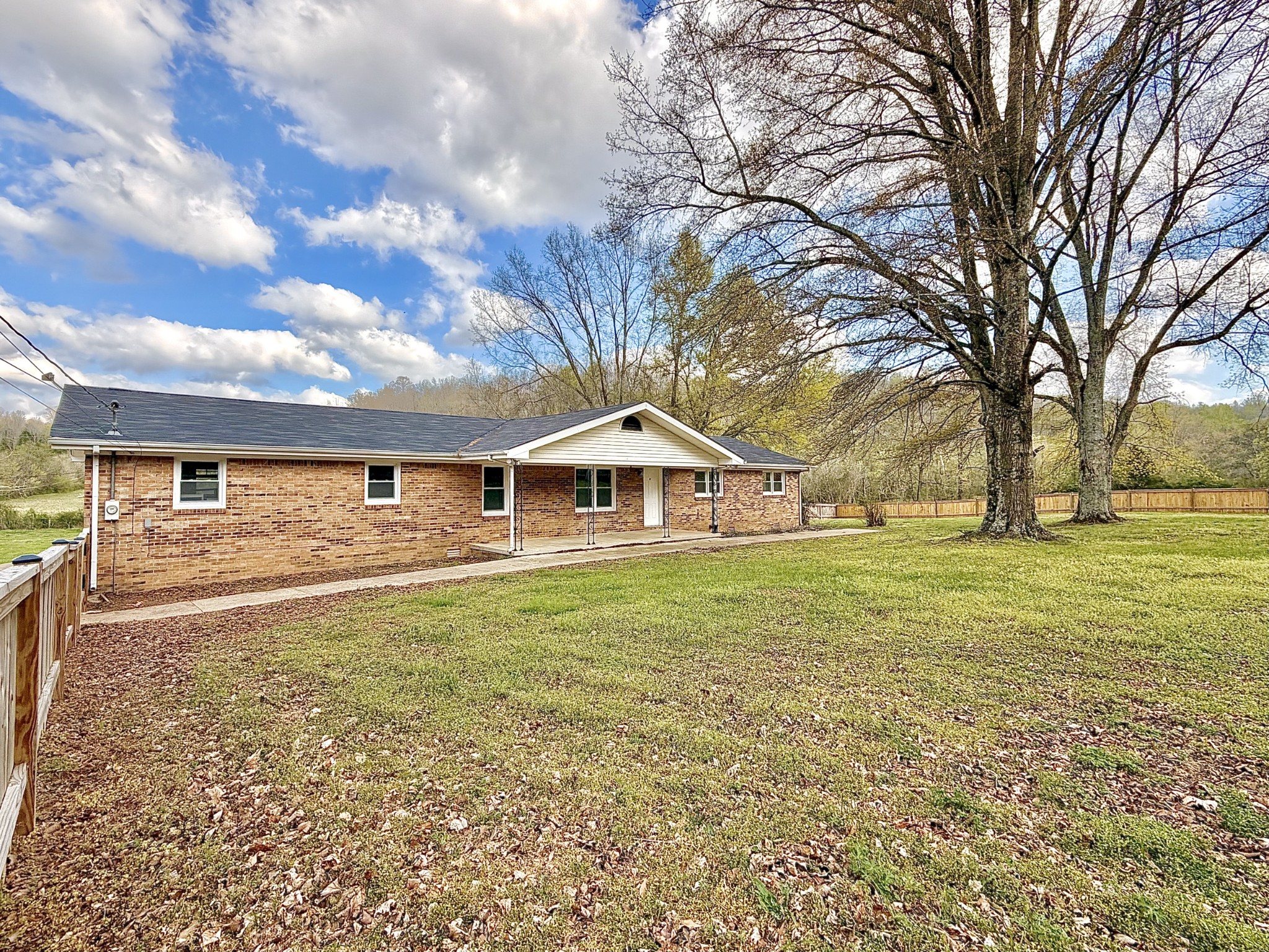 1595 Hurricane Creek Road Lawrenceburg, TN 38464 - Photo 13 of 74 a front view of a house with a yard