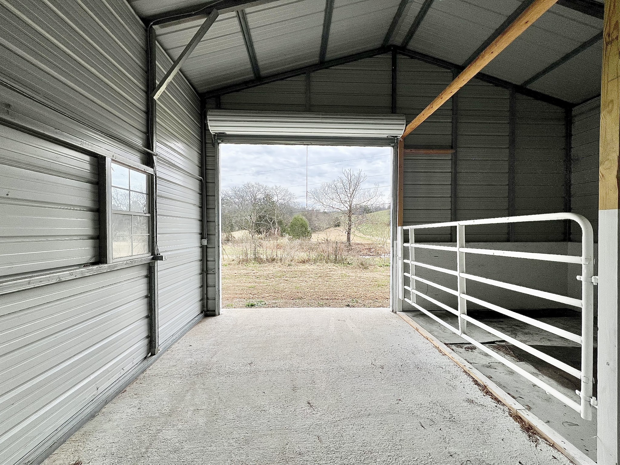 1595 Hurricane Creek Road Lawrenceburg, TN 38464 - Photo 48 of 74 a view of deck with wooden floor and a floor to ceiling window