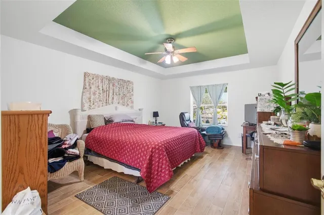 a living room with furniture a large window and a fireplace