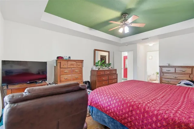 a dining room with furniture and a potted plant