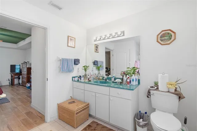 a kitchen with stainless steel appliances white cabinets and a granite counter tops