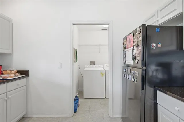 an aerial view of lake and residential houses with outdoor space