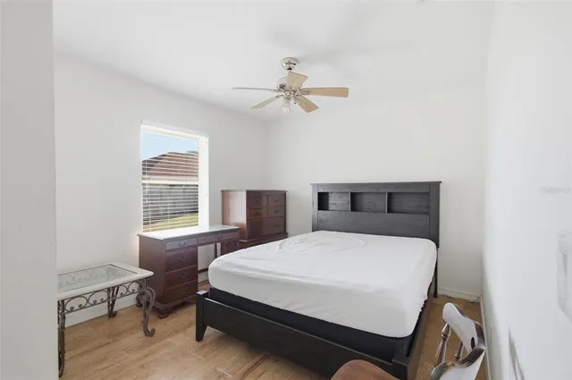 an aerial view of a house with a yard and lake view