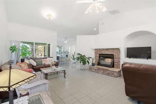 a living room with furniture fireplace and a chandelier