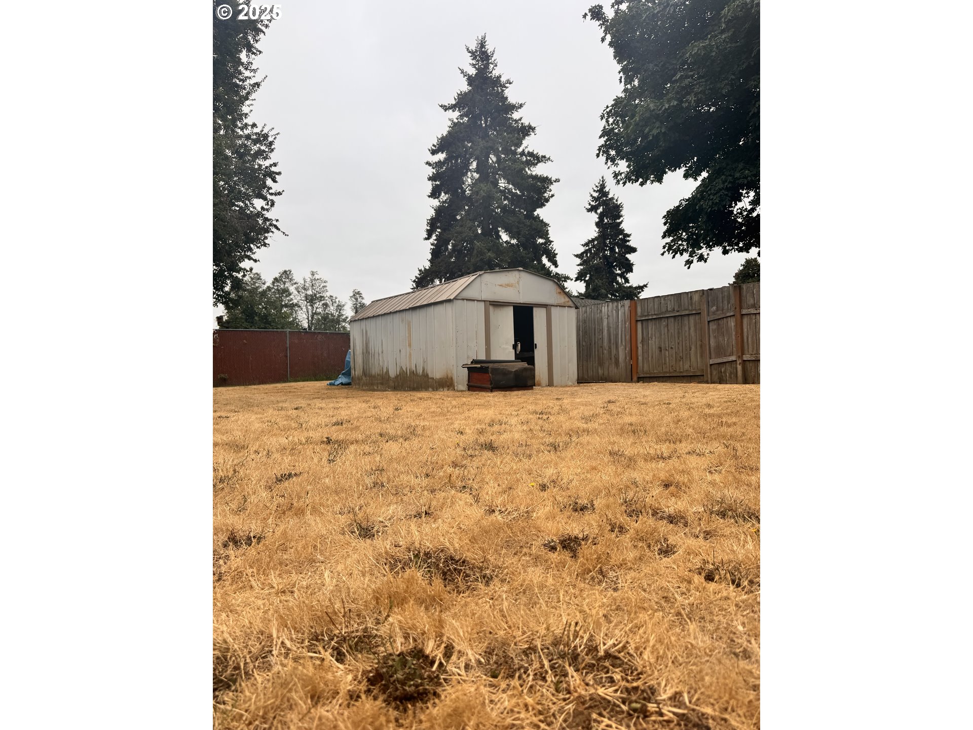 560 Maple Street Aumsville, OR 97325 - Photo 11 of 12 a view of wooden fence