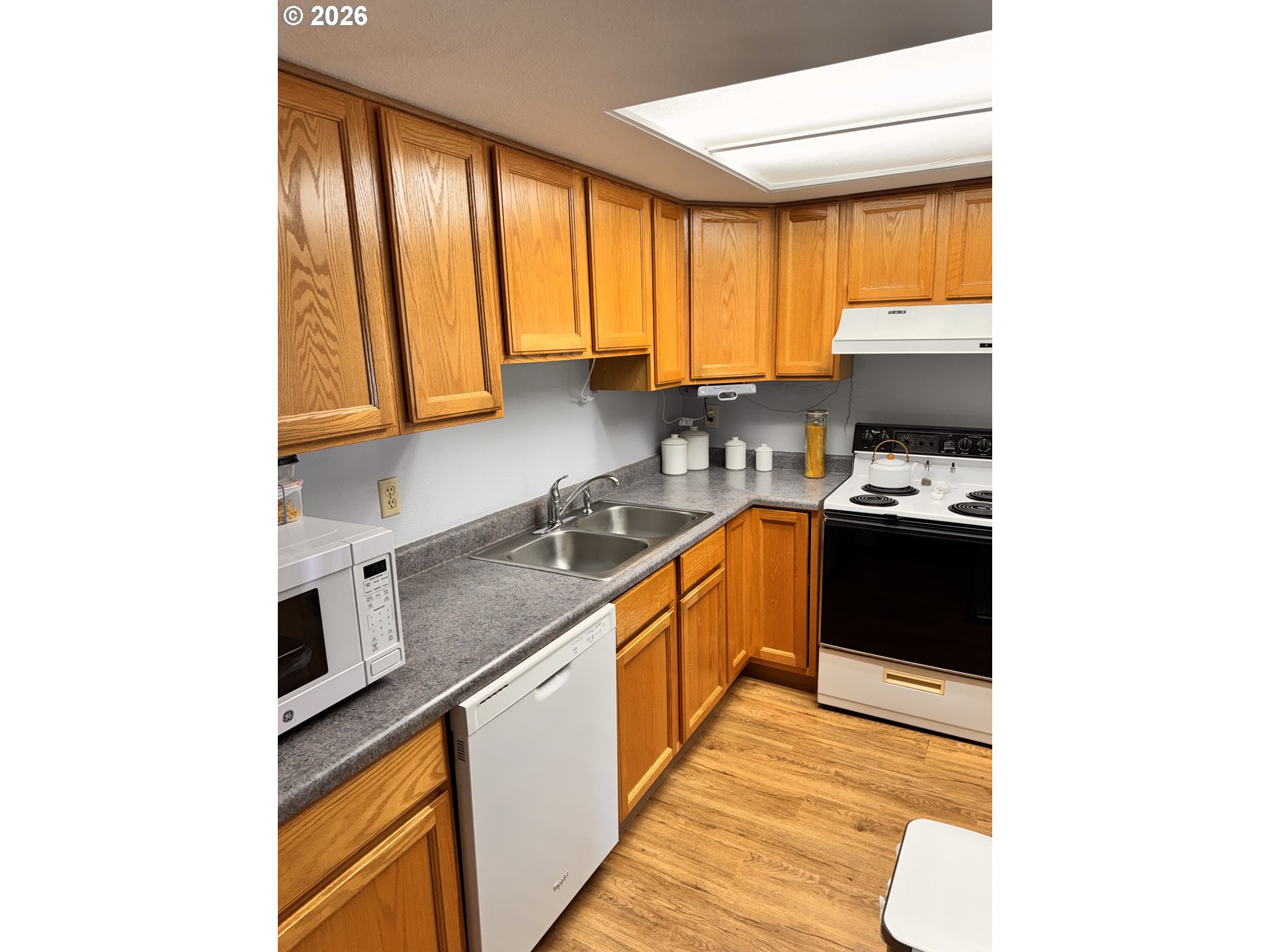 560 Maple Street Aumsville, OR 97325 - Photo 12 of 12 a kitchen with a sink cabinets and a window