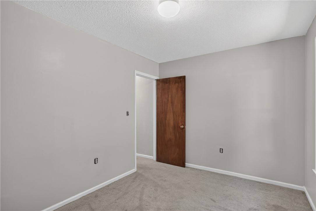 1412 Simpson Road Pendleton, SC 29670 - Photo 31 of 48 An inviting room features plush carpet and a well-maintained wooden door.