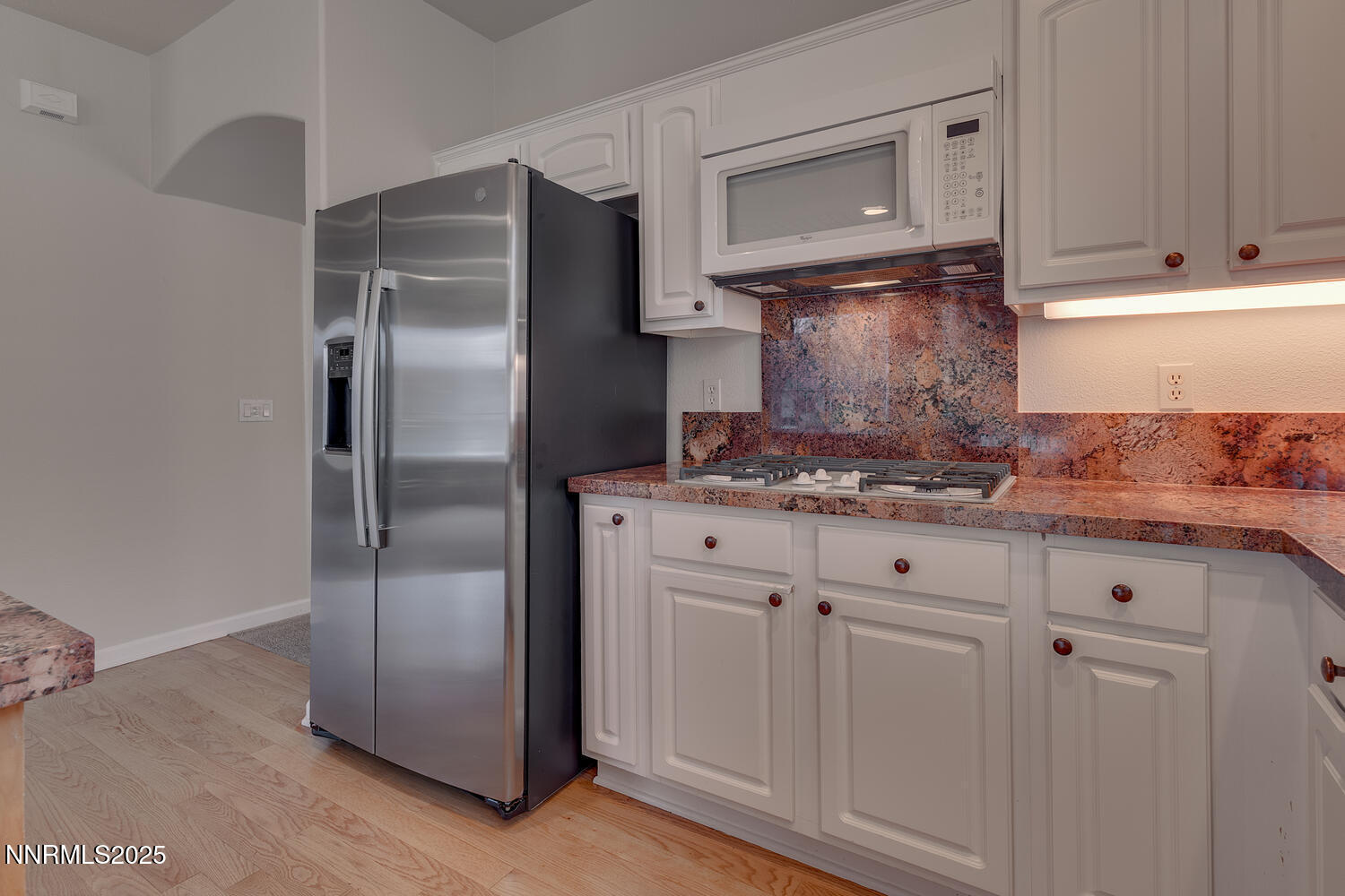 1150 Brookhollow Lane Reno, NV 89519 - Photo 14 of 30 a kitchen with stainless steel appliances granite countertop a refrigerator and a stove