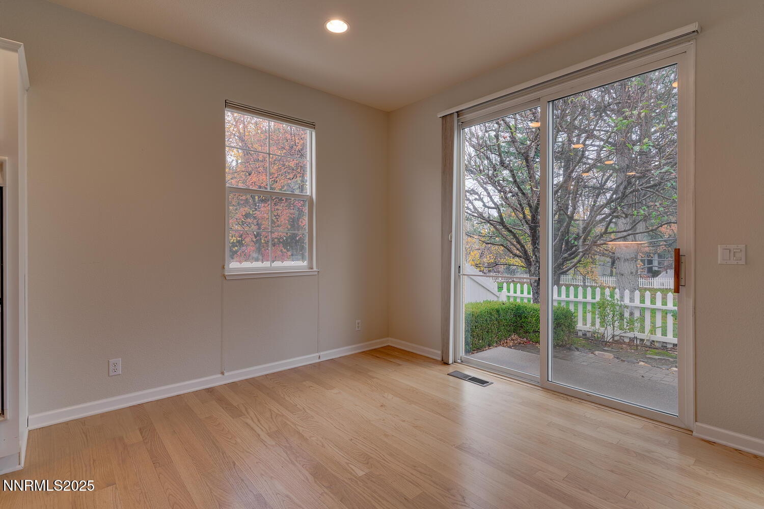1150 Brookhollow Lane Reno, NV 89519 - Photo 15 of 30 a view of an empty room with wooden floor and a window