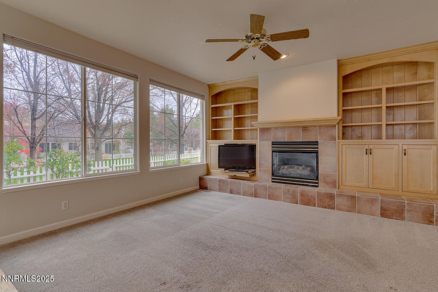 1150 Brookhollow Lane Reno, NV 89519 - Photo 16 of 30 a view of an empty room with a fireplace and a window