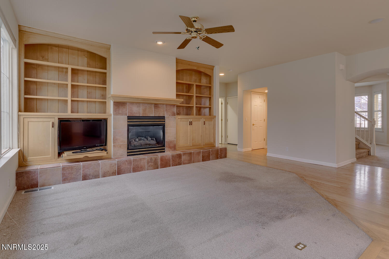 1150 Brookhollow Lane Reno, NV 89519 - Photo 17 of 30 a view of a livingroom with furniture fireplace and a ceiling fan