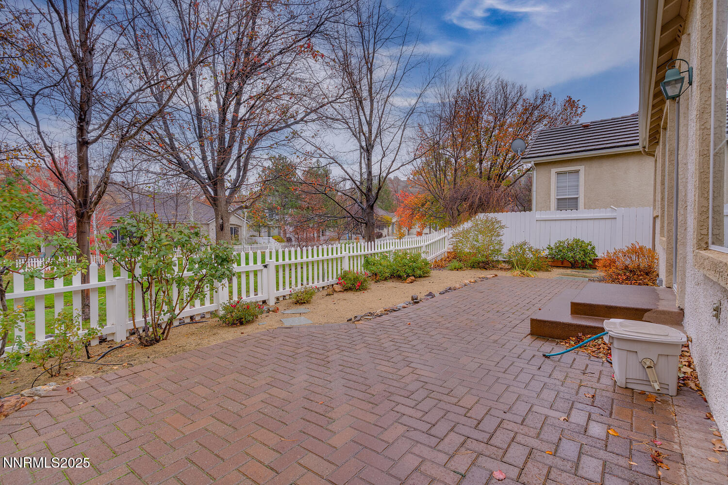 1150 Brookhollow Lane Reno, NV 89519 - Photo 18 of 30 a view of a street with potted plants and large trees
