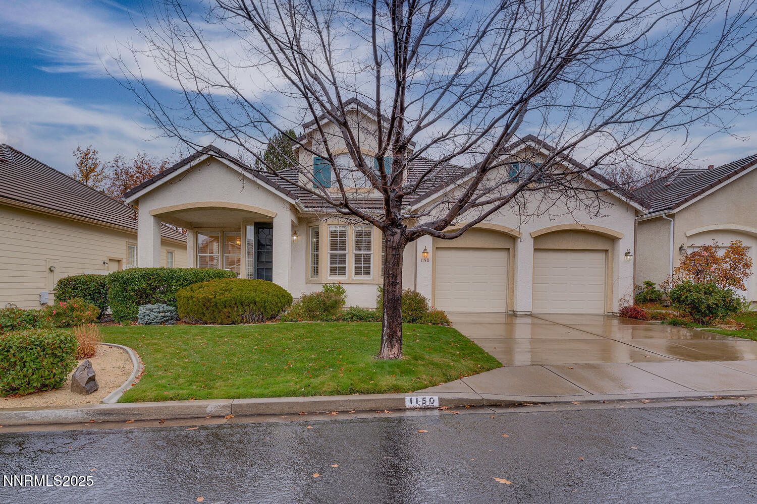 1150 Brookhollow Lane Reno, NV 89519 - Photo 2 of 30 a front view of a house with a yard and garage