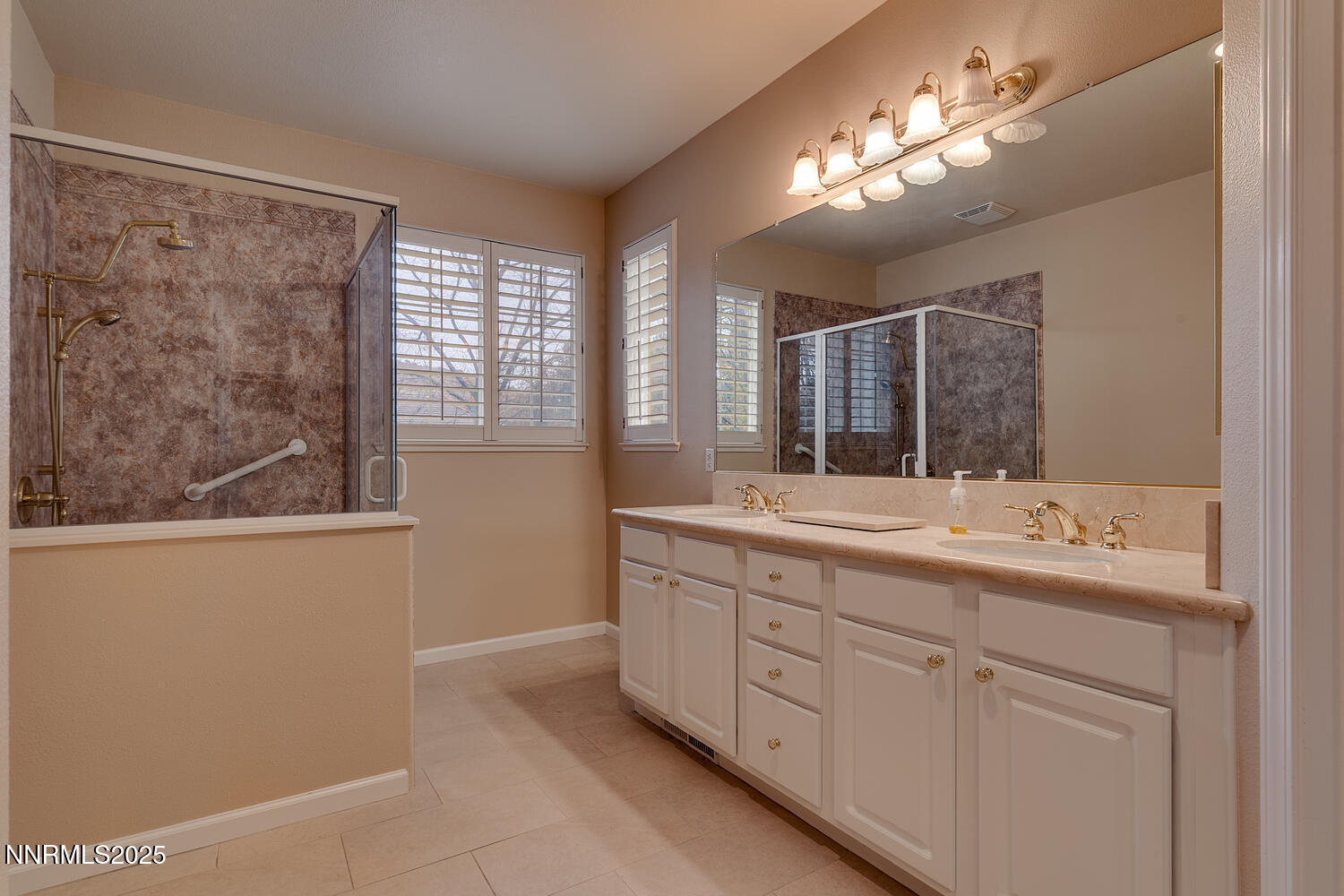 1150 Brookhollow Lane Reno, NV 89519 - Photo 24 of 30 a bathroom with a double vanity sink and a mirror