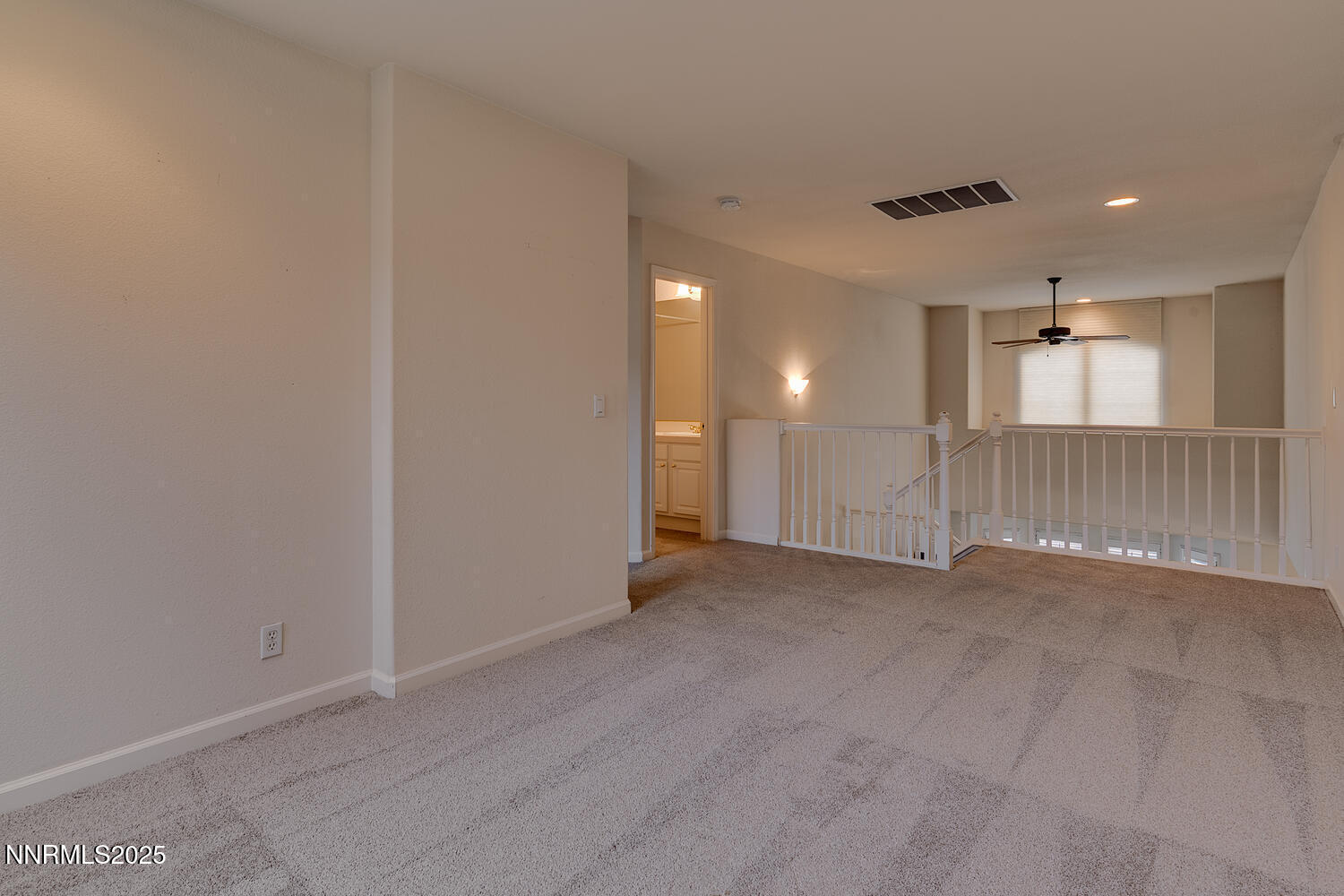 1150 Brookhollow Lane Reno, NV 89519 - Photo 27 of 30 an empty room with a empty space and windows