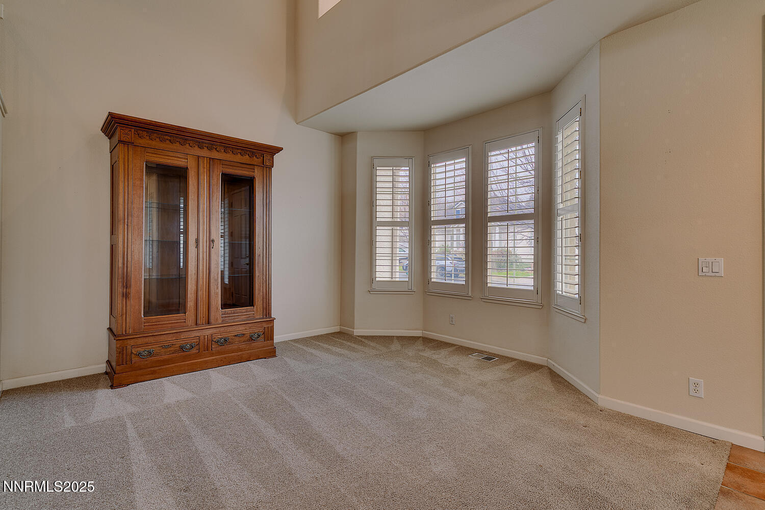 1150 Brookhollow Lane Reno, NV 89519 - Photo 9 of 30 a view of an empty room with a fireplace and window